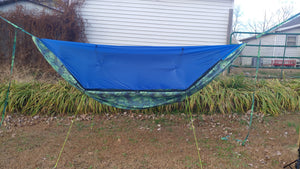 This is a custom hammock that is a custom version of our Polar Bear Hammock. The Polar Bear is our winter hammock that has a Top cover to block out that winter chill. The Top Cover has many venting options to help with condensation.